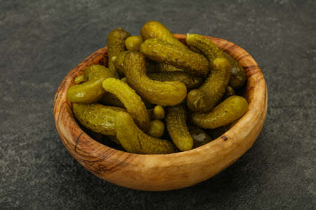 Pickled young gherkin in the bowlの写真素材