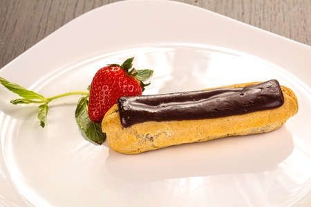 Sweet tasty eclair with chocolate icing