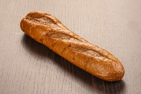 Crust tasty baguette over board isolated