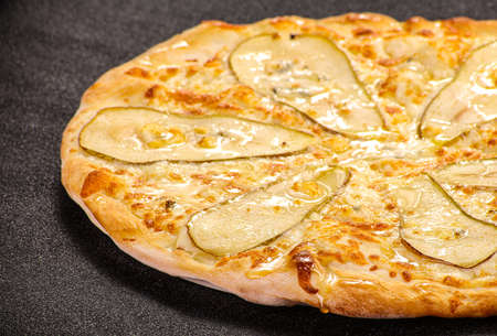 Pizza with pear, cheese and honeyの写真素材