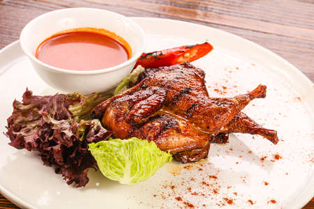 Dietary Roasted quail with tomato sauceの写真素材