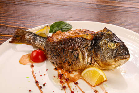 Stuffed dorada fish vith vegetables and cheeseの写真素材