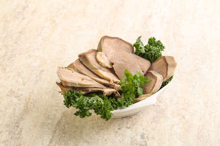 Sliced Pork Tongue snack appetizer served basilの写真素材