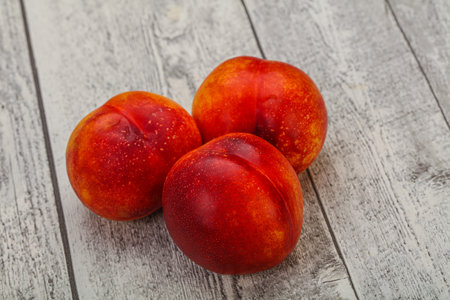 Ripe sweet tasty red Nectarine fruitの写真素材