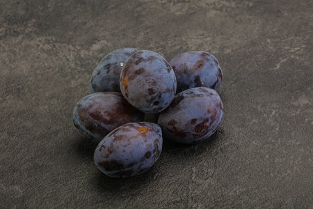 Purple sweet ripe tasty plum heapの写真素材