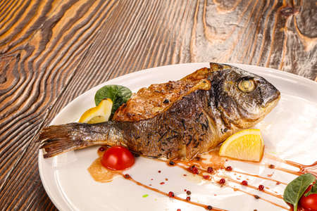 Stuffed dorada fish vith vegetables and cheeseの写真素材