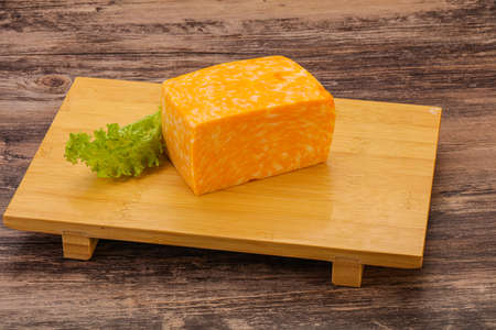 Dairy Marble cheese brick over boardの写真素材