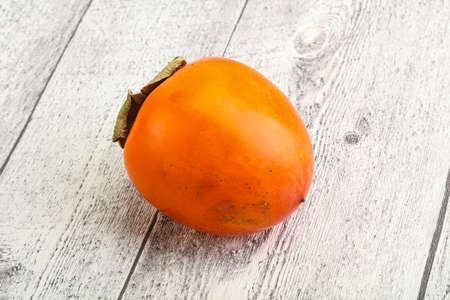 Ripe sweet and tasty persimmon fruitの写真素材