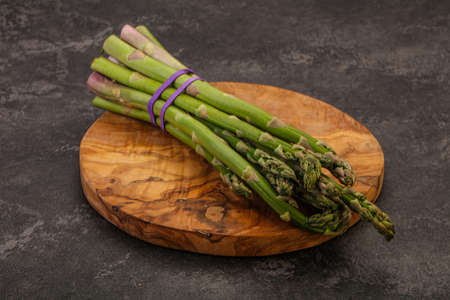 Vegan cuisine - Raw asparagus heap  for cookingの写真素材
