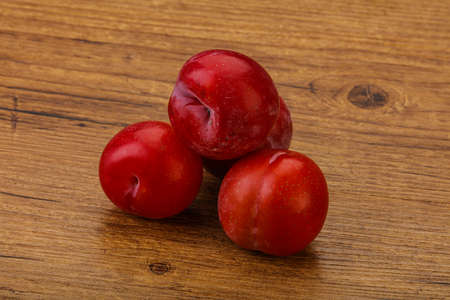 Ripe sweet tasty red plum heapの写真素材