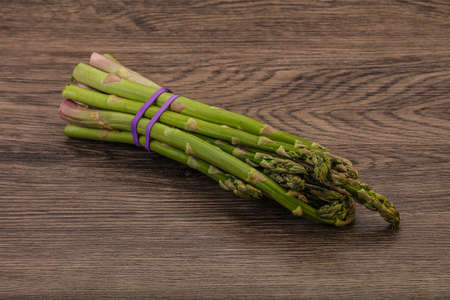 Vegan cuisine - Raw asparagus heap  for cookingの写真素材
