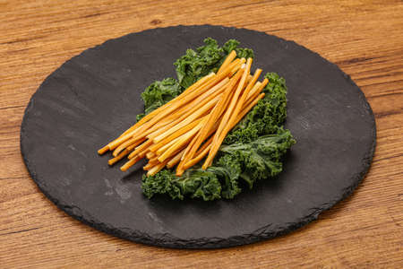 Caucasian Chechel cheese sticks over boardの写真素材