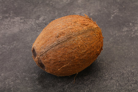 Tropical brown coconut over background isolatedの写真素材