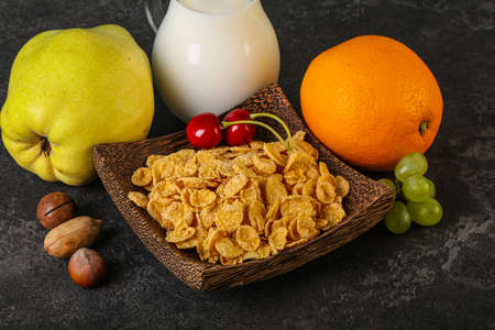 Breakfast with corn flakes, fruits and milk