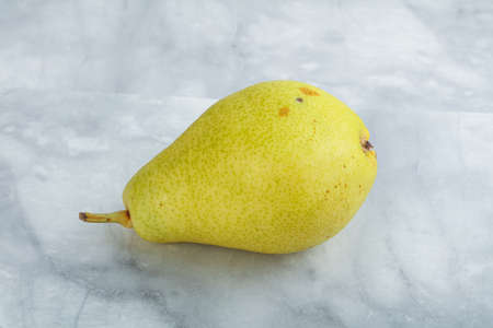 Sweet tasty ripe Yellow pear over backgroundの写真素材