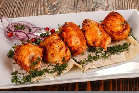 Chicken breast kebab shashlik served salad adn rosemaryの写真素材