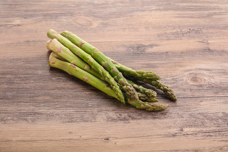 Raw ripe green fresh asparagus for dietary cuisineの写真素材