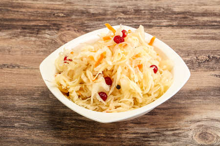 Tasty sauerkraut with cranberry in the bowlの写真素材