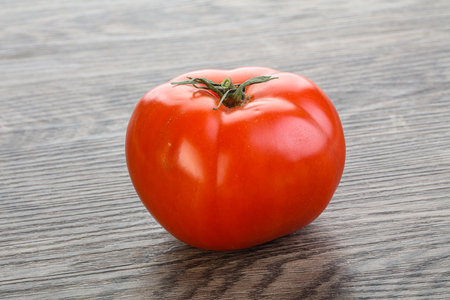 Red ripe big juicy tomato isolatedの写真素材