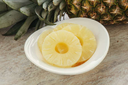 Marinated sweet pineapple rings in the bowl