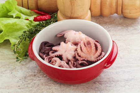 Marinated baby octopus seafood in the bowl for snack or saladの写真素材