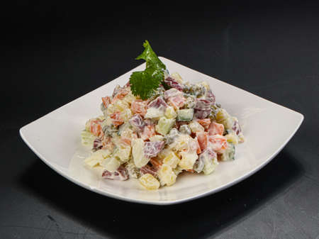 Traditional Russan salad Olivier with sausages and potatoの写真素材