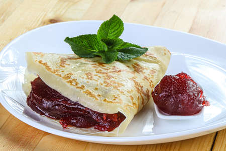 Delicous sweet pancake with fruit jamの写真素材
