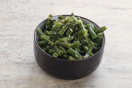 Boiled green bean garnish with sesame seeds
