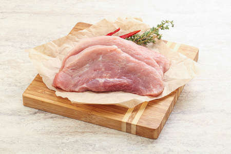 Raw pork schnitzel cut for roastの写真素材