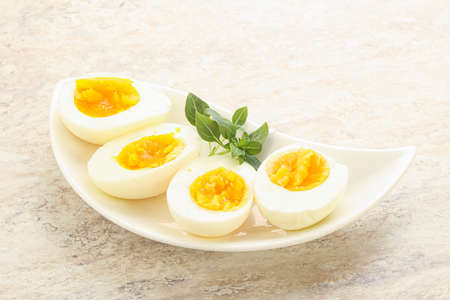 Boiled chicken egg for breakfast without eggshell in the bowl