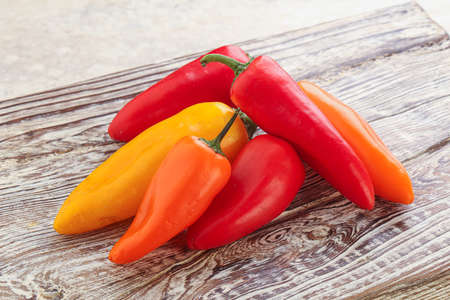 Ripe juicy baby various color bell peppers heap
