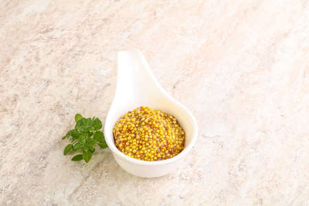 Grain mustard spicy sauce in the bowlの写真素材