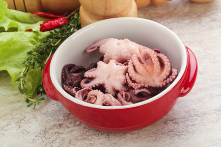 Marinated baby octopus seafood in the bowl for snack or saladの写真素材