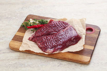 Raw beef machete steak for grill served thyme,の写真素材