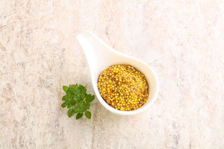 Grain mustard spicy sauce in the bowlの写真素材