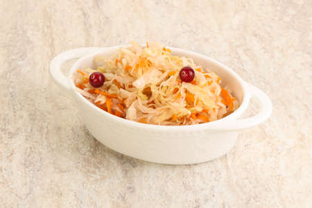 Fermented cabbage with carrot - sauerkraut in the bowlの写真素材