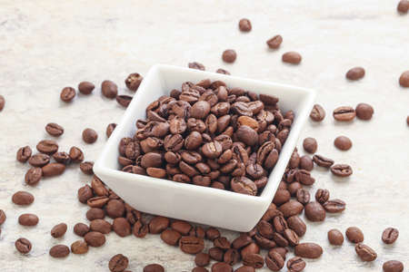 Roasted Arabica coffee beans in the bowl