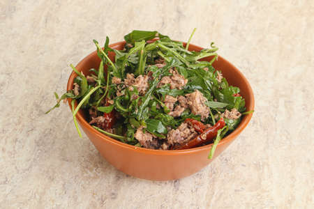 Salad with tuna, olives, dry tomato and rucolaの写真素材