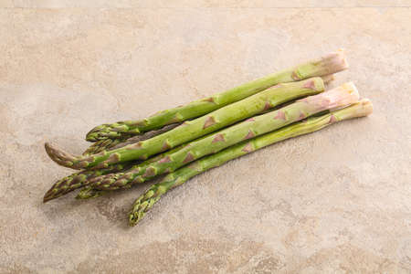 Raw ripe green fresh asparagus for dietary cuisineの写真素材