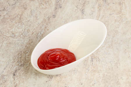 Hot and spicy Sriracha sauce in the bowlの写真素材