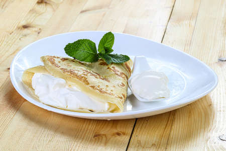 Tasty hot Pancake with sour creamの写真素材