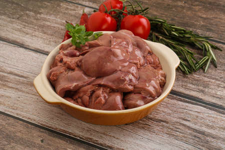 Raw chicken liver in the bowl for cookingの写真素材