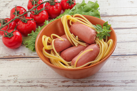 Mini sausages with pasta spaghetti for kidsの写真素材
