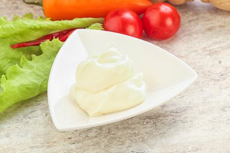 Organic homemade mayonnaise sauce in the bowlの写真素材
