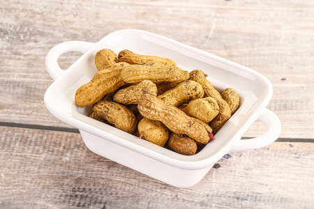 Raw ripe unpeeled peanut heap snack