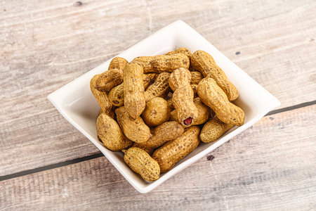 Raw ripe unpeeled peanut heap snackの写真素材