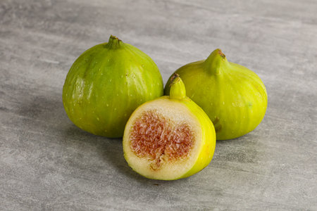 Ripe sweet juicy green fig fruit heapの写真素材