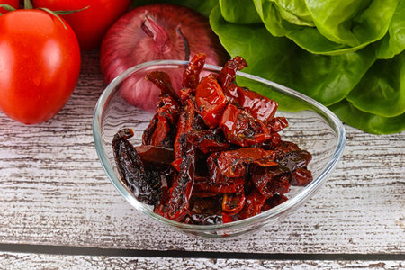 Dry tomato with olive oil in the bowlの写真素材