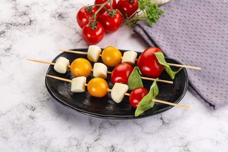 Italian caprese salad kebab stick snackの写真素材