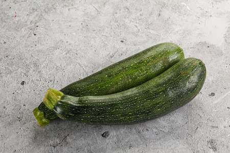 Raw young small green zucchini for cockingの写真素材